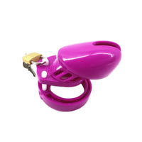Sissy penis cage in vibrant magenta caters to uncut, uncircumcised users. Foreskin and PA friendly with ribbed, adjustable design for comfort. Perfect for discreet, long-term wear.