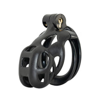 Unlock a new realm of control with the Dark Cobra Male cage. This sleek device crowns your experience, secured with a discreet screw. Its innovative design features thorn-like textures, preventing bigger distractions and embodying the stealth of a cobra.