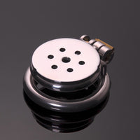 In the realm of chastity, the Flat Gatling offers unique control with its flat male chastity design, turning your member into an inny. Little nubs enhance sensation, while the secure gatling lock adds a thrilling dynamic.