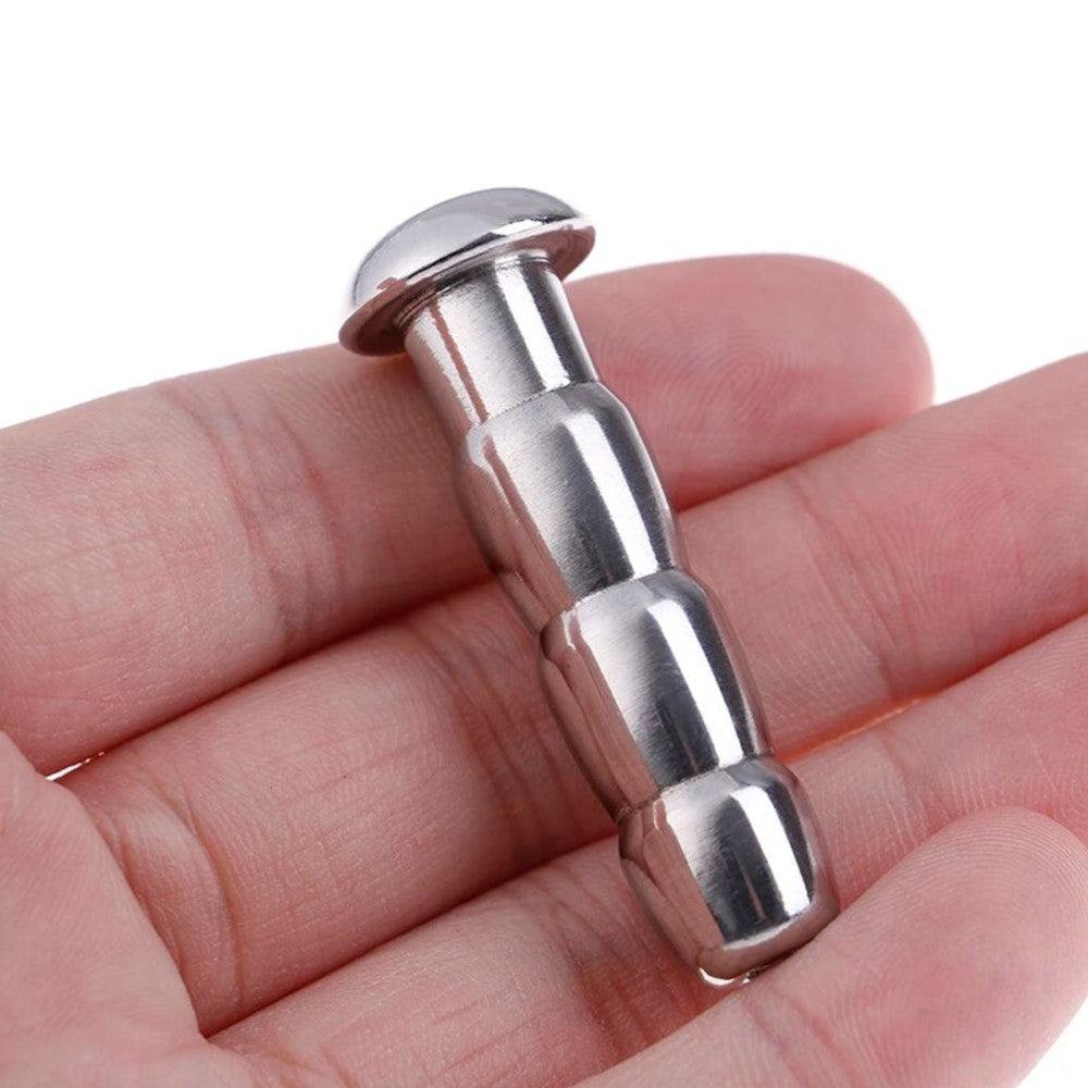 Elevate your urethral play with our ribbed metal plug, tailored for size versatility from smaller to intense widths. Combat shrink fears and embrace controlled expansion all while erect!