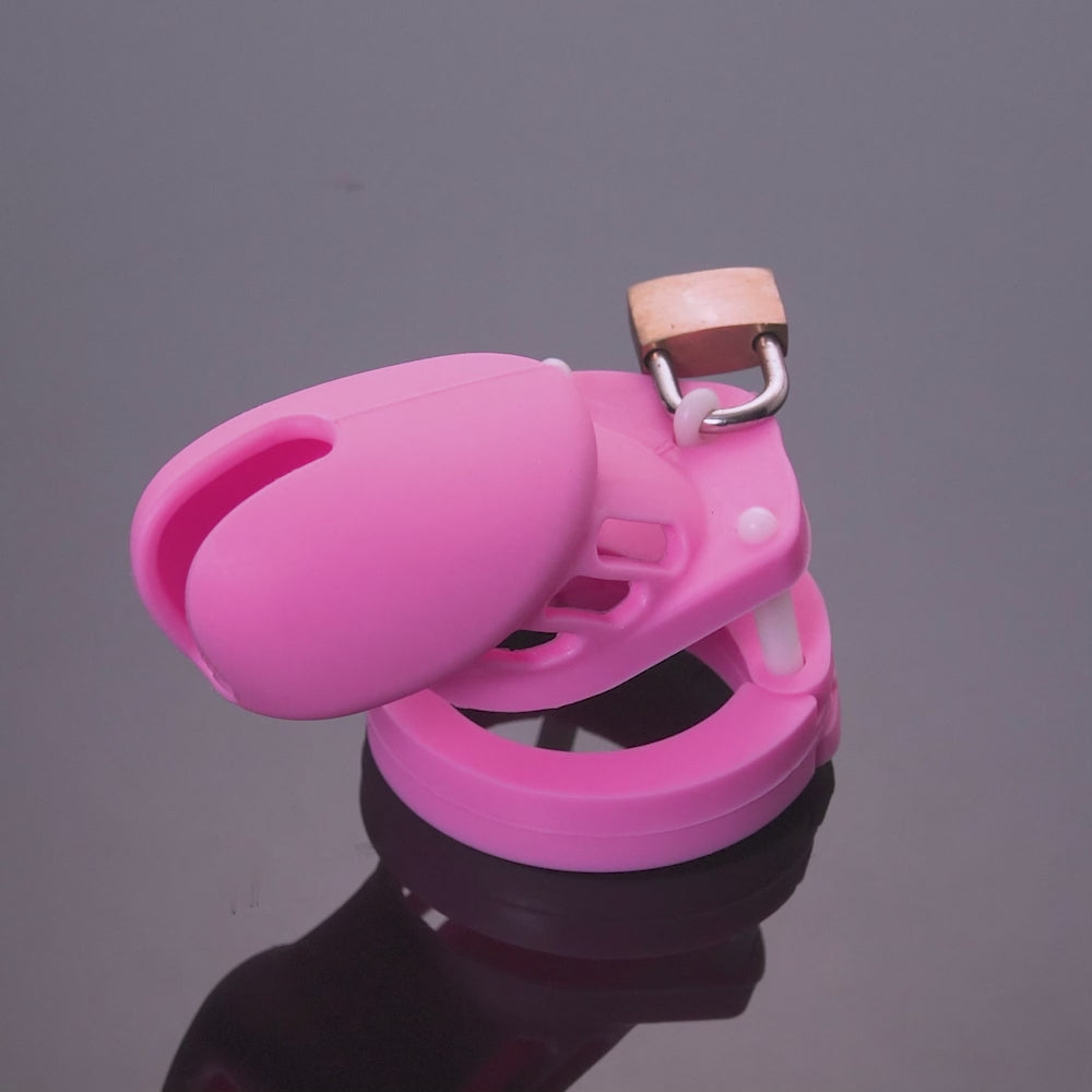 Silicone cock cage awakens sissy fantasies. Hypoallergenic, it ensures skin won't react adversely, securing the truth of longing. A gentle reminder of submission awaits in vibrant colors.